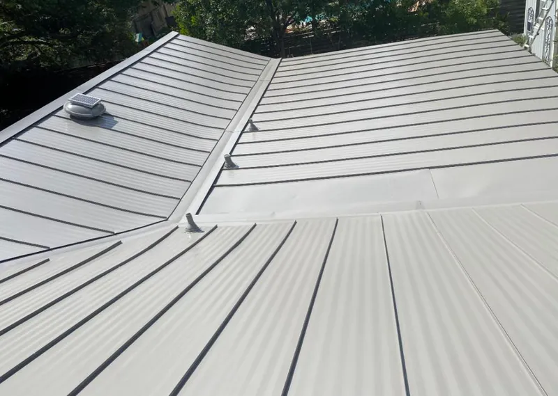 Solar attic fan installed on a metal roof for Roof Ventilation in Waikele